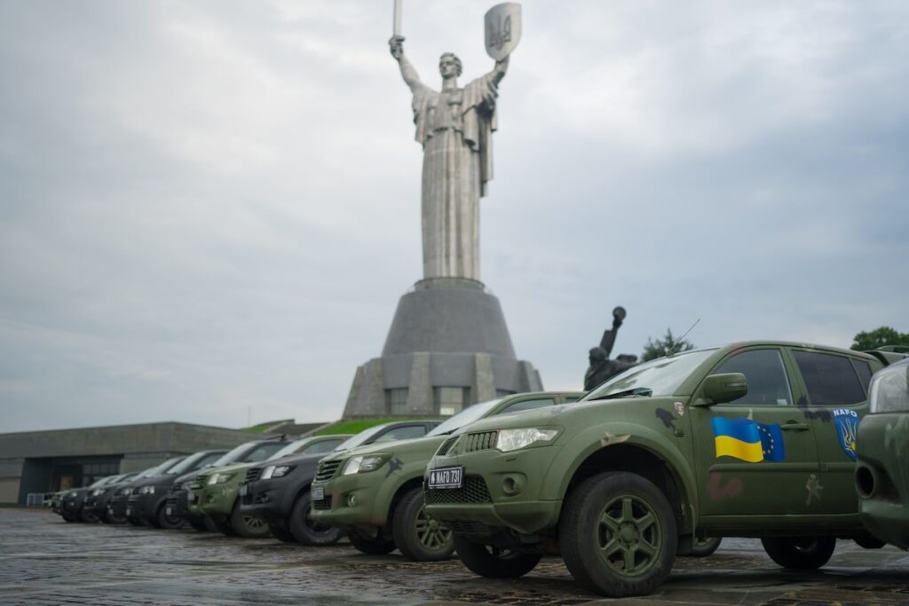 A second view of the NAFO vehicle handover near the Mother Ukraine monument in Kyiv